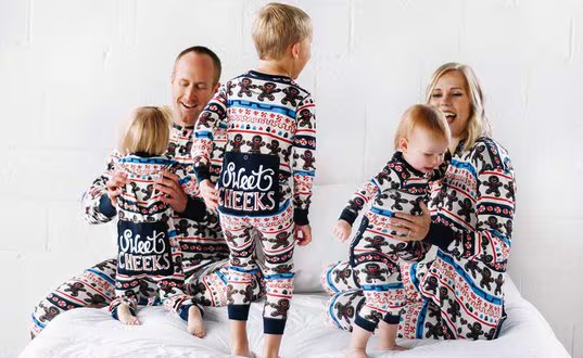 family of five wearing matching Fair Isle flapjack onesies with 'Sweet Cheeks' on flapjack