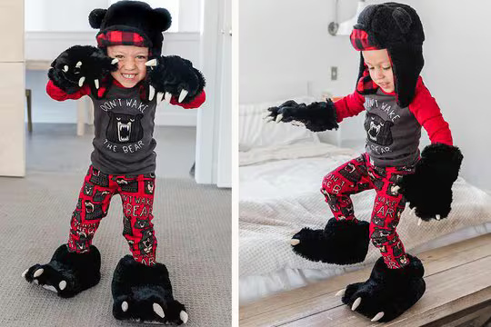 boy wearing bear themed pajamas, mitts and slippers