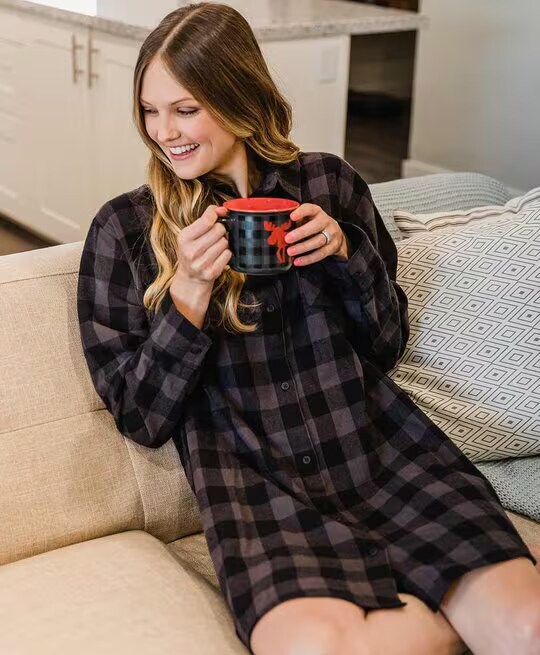 woman wearing a plaid nightshirt while holding a matching mug